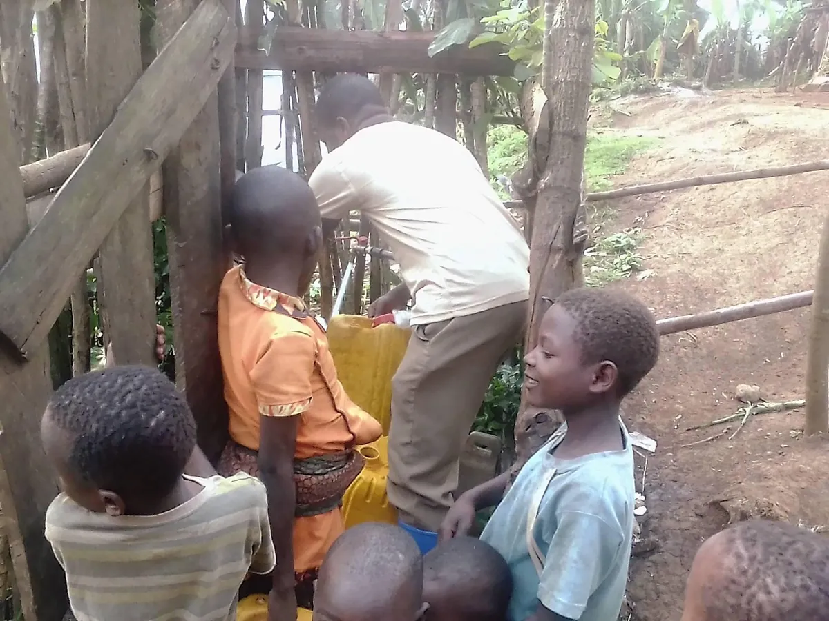 Community members gathered at a Clean Water Help project site in DR Congo