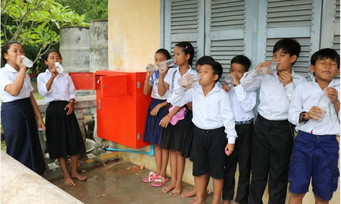 Students drink from their school water system in Kampot