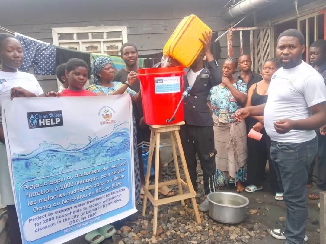 Pouring water into a new filter bucket during installation
