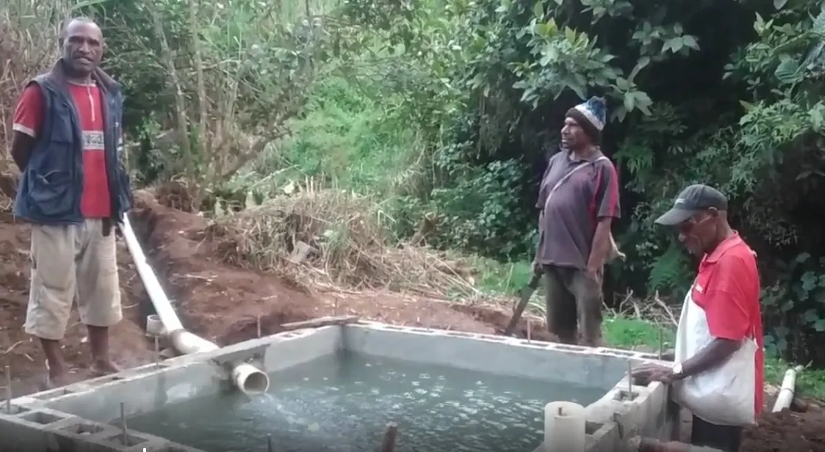 Creek water collects in the concrete catchment