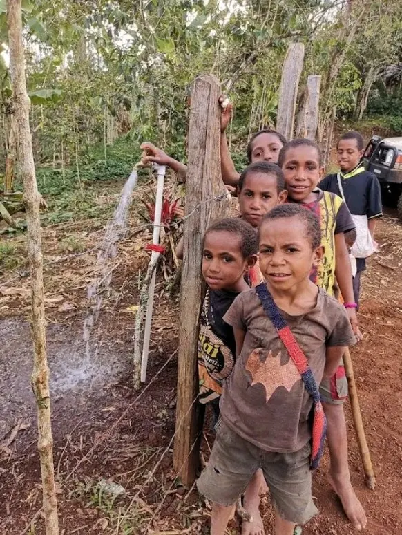 Children at a village tap in the Eastern Highlands, where our next scholarship students will come from