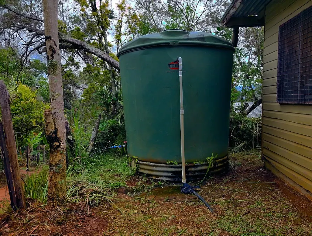 A storage tank beside a village building