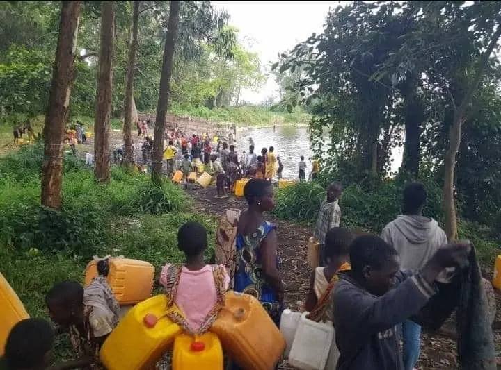 Collecting untreated water in North Kivu